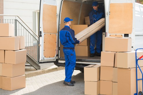 Furniture pick-up team collecting bulky household furniture in Aldersbrook