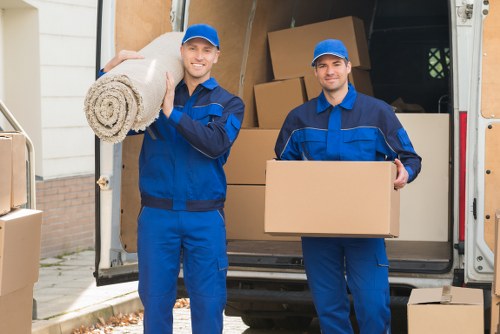 Crew separating recyclable materials during a van removal job