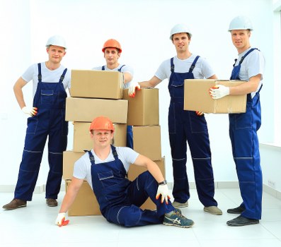 Packed boxes and furniture prepared for a house move in Aldersbrook