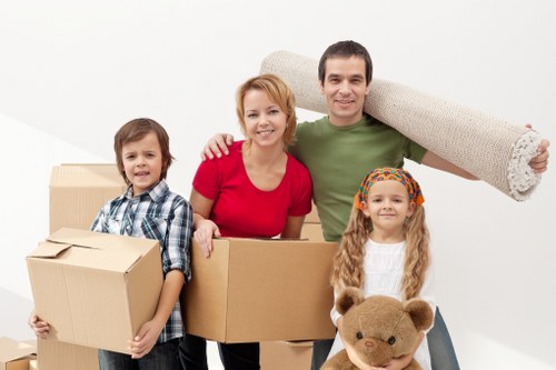 Careful carrying of household items through a flat staircase