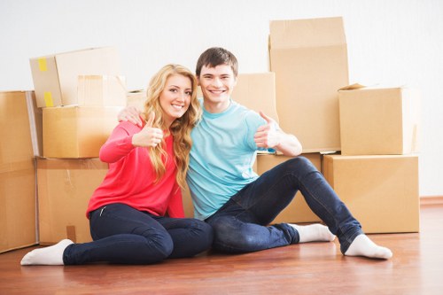 Trained movers handling items with care during an Aldersbrook relocation