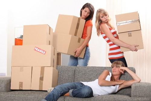 Professional movers packing household items for a local Aldersbrook relocation