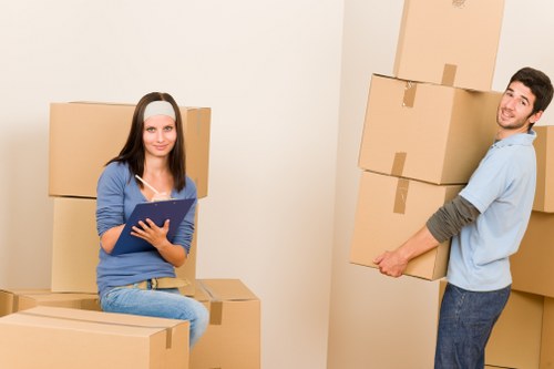 Packed office equipment and labelled boxes ready for a move in Aldersbrook